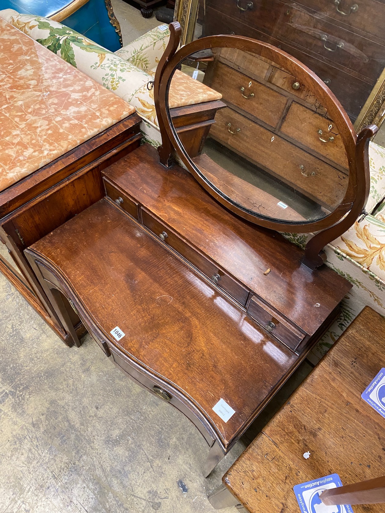 A George III style mahogany serpentine dressing table, width 72cm, depth 46cm, height 120cm